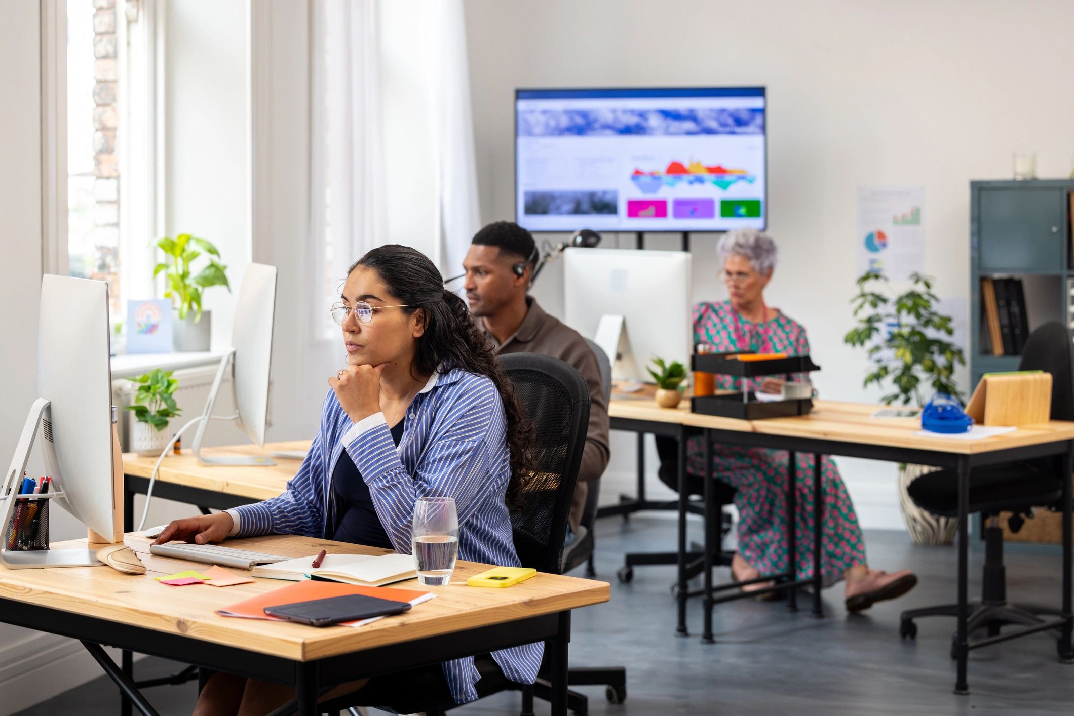 Cybersecurity analysts monitoring threat dashboards in a security operations center
